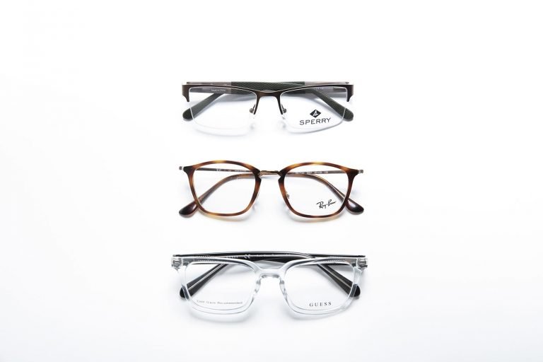 Men's Sperry, Ray-Ban, and Guess eyeglass frames on a white background