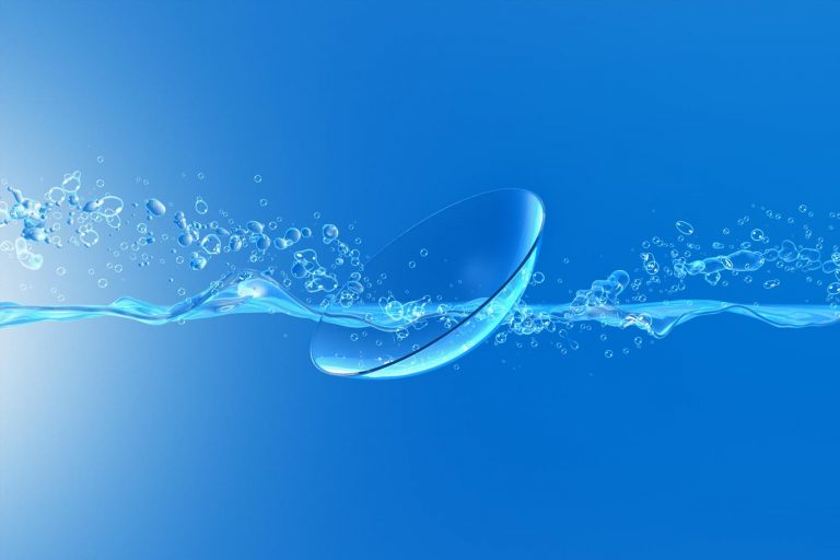 Contact lens with water stream and blue background